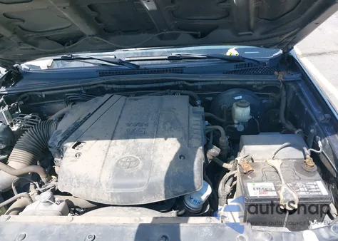 2015 Toyota Tacoma Base V6 z USA, uszkodzony, nr VIN 3TMLU4EN1FM177255